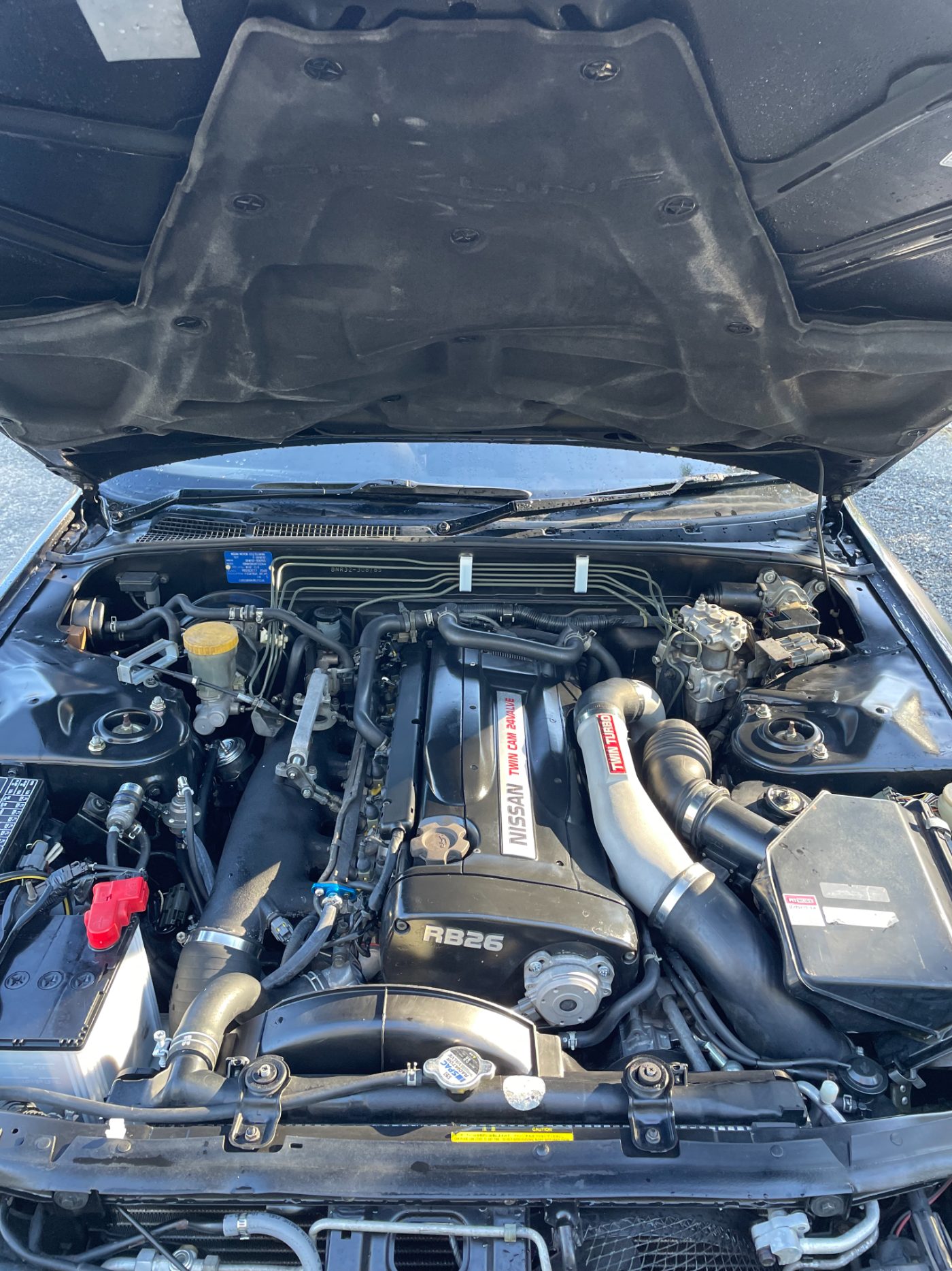 Stock RB26 engine bay before the BNR build